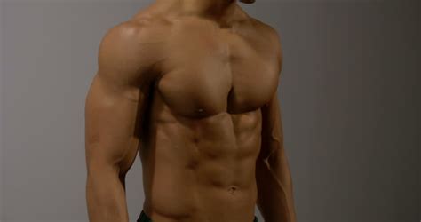 male fitness model displays his muscular Stock Footage Video (100% ...