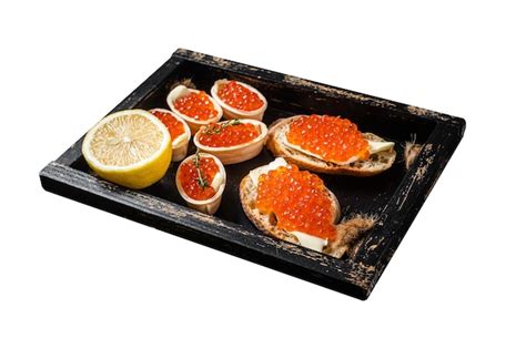 Premium Photo Toasts And Tartlets With Red Caviar And Butter In