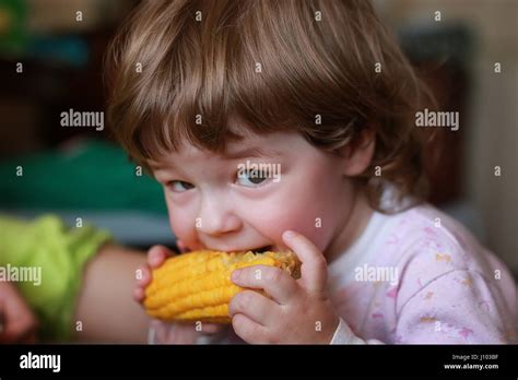 Child Eating Cob Roasted Corn Food Hi Res Stock Photography And Images