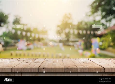 Empty Wooden Table Top And Abstract Blurred Light Bokeh And Blur