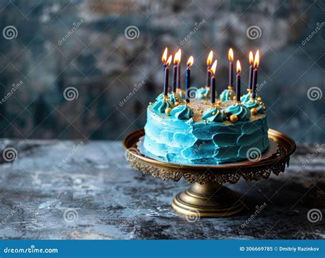 Elegant Blue Frosted Birthday Cake With Lit Candles And Golden