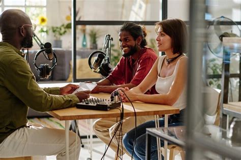 Premium Photo Group Of Young Multicultural People Sitting By Desk In