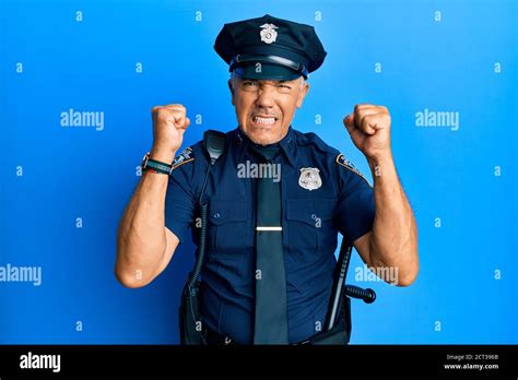 Handsome Middle Age Mature Man Wearing Police Uniform Angry And Mad