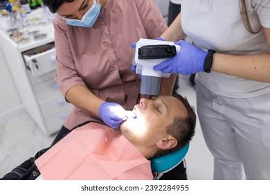 Male Orthodontist Scanning Over 308 Royalty Free Licensable Stock