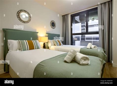 A Bedroom With Two Single Beds With Contemporary Decoration Two
