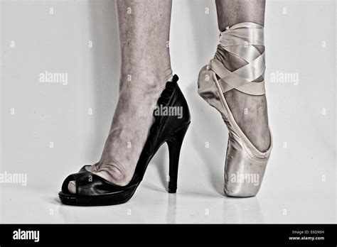 Legs Of A Ballerina With A Black High Heel Shoe In One Feet And A Pointe Ballet Shoe In The