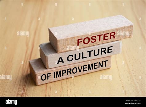 Foster A Culture Of Improvement Text On Wooden Blocks Operational