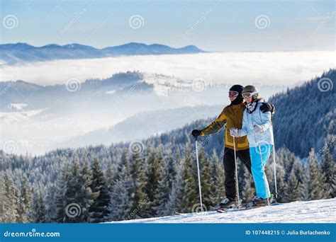 Couple Of Happy Skiers Stock Image Image Of Background 107448215