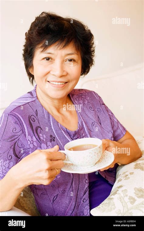 Portrait Of A Mature Woman Holding A Cup Of Tea Stock Photo Alamy