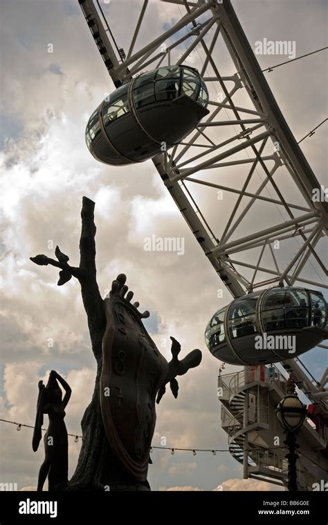 London Eye And Dali Sculpture In South Bank London England Uk Stock