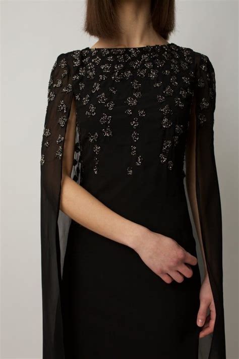 Black Cape Dress With Embellishment On The Shoulders And Chest In 2021