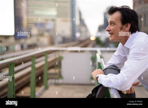 Mature Handsome Businessman Waiting And Thinking In Train Station Stock