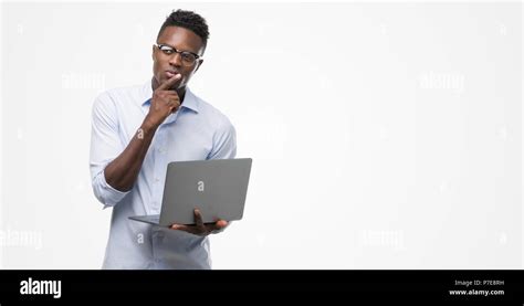 Young African American Businessman Using Computer Laptop Serious Face