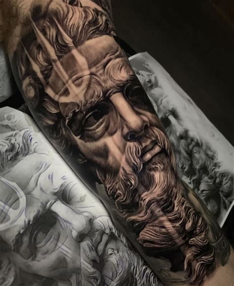 A Man S Arm With An Image Of Jesus On It