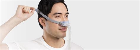 Sleep Apnoea Patient Adjusting Airfit N30 Nasal Cradle Mask Resmed Uk