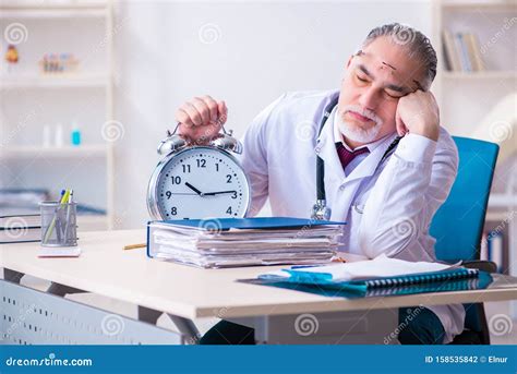 Old Male Doctor Working In The Clinic Stock Photo Image Of Missing