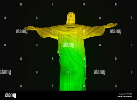 Night view of Christ the Redeemer ilumidado with the colors of the ...