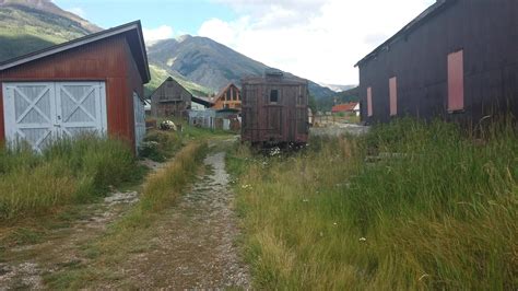 Century Old Narrow Gauge Railroad Equipment Sitting In Lot Next To The