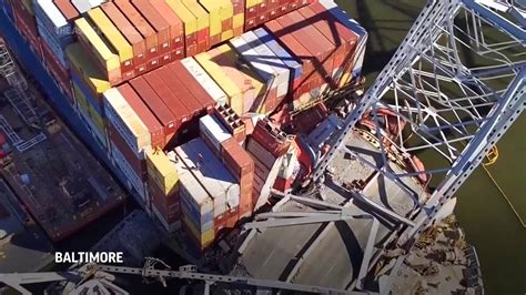 Video Crews Begin Removing Containers From The Ship That Collapsed