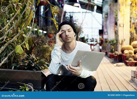 Handsome Attractive Hipster Man Tired On Work Sitting Outside In A