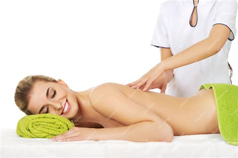 Premium Photo Midsection Of Massage Therapist Massaging Shirtless Female Customer Against