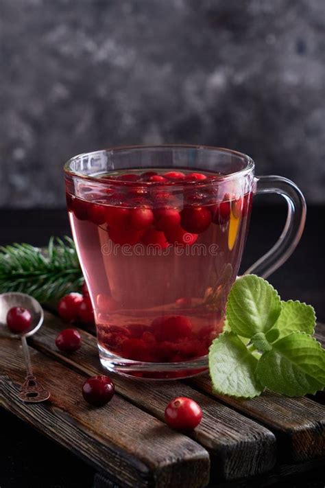 Cranberry Juice With Honey In A Cup Cranberries In Sugar On A Dark