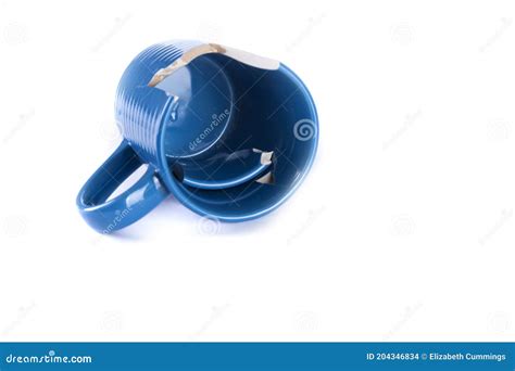 Broken Mug With Shattered Pieces Inside Laying Down Stock Photo Image