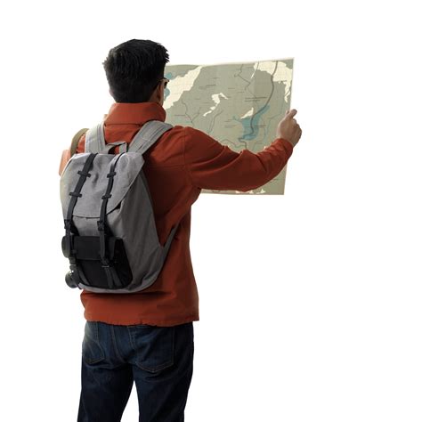 A Young Traveler Man With Backpack In Look Searching Direction On