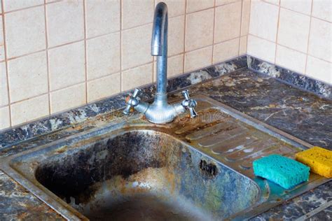 Very Dirty Kitchen Sink The Kitchen And Dishwashing Area Need To Be