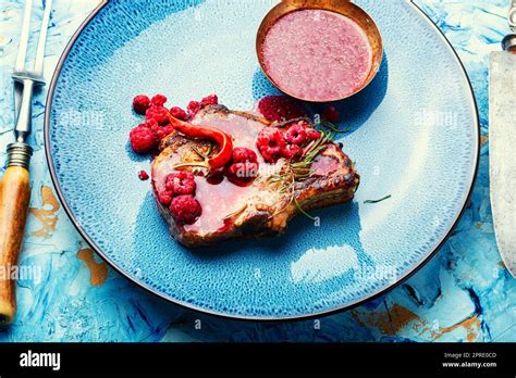 Pork Steak With Berry Sauce Stock Photo Alamy