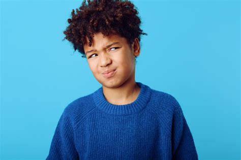 Premium Photo Playful Young African American Boy Expressing Joy With