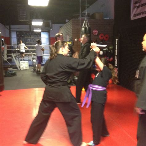 Sensei Christina And Sempai Sensei Bob Teach Purple Belt Juliana Knife