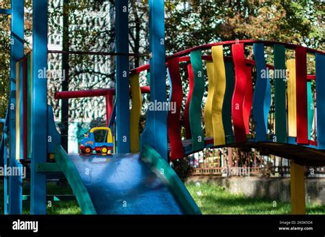 Bright Multi Colored Playground In Courtyard Of Multi Storey Buildings