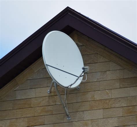 Premium Photo Satellite Dish On The Front Of The House