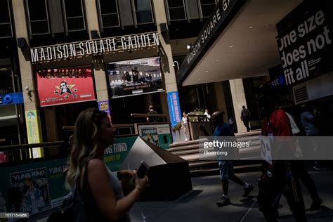 Pedestrians Pass In Front Of The Madison Square Garden Co Venue In