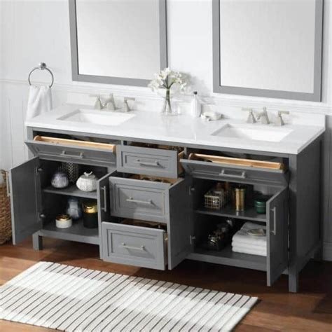 A Bathroom Vanity With Two Sinks And Mirrors On The Wall Next To A