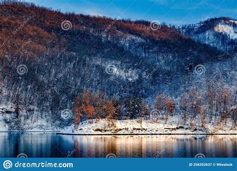 Scenic View Of Kopaonik Mountain Reflecting In Celije Lake At Sunset