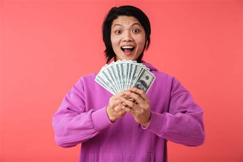 Premium Photo Portrait Of A Cheerful Asian Man Standing Isolated Over