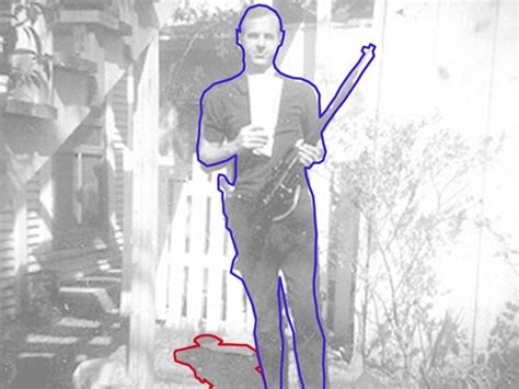 Lee Harvey Oswald Holding Rifle