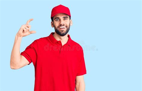 Young Handsome Man With Beard Wearing Delivery Uniform Smiling And