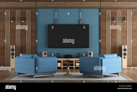 Home Cinema Room With Tv Hanging On Blue Wall Stock Photo Alamy