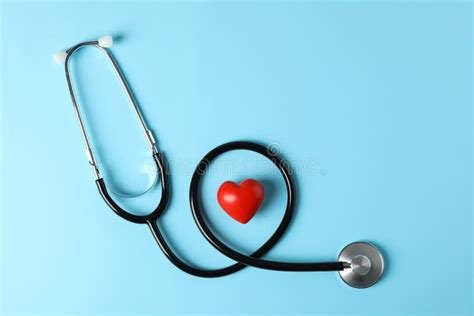 Stethoscope And Heart On Blue Background Stock Photo Image Of