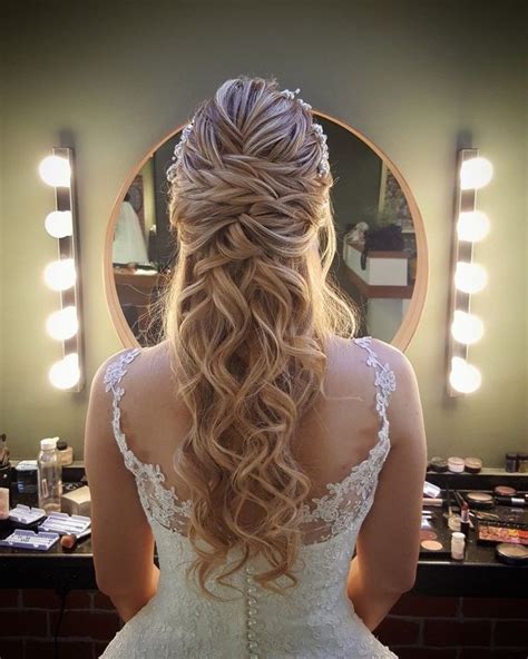 The Back Of A Womans Head In Front Of A Mirror With Lights On