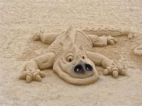 Happy sand dragon | Sand sculptures, Sand art, Beach sand art