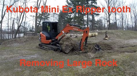 Kubota KX 033 Mini Excavator Removing Huge Rock Buried With New Ripper