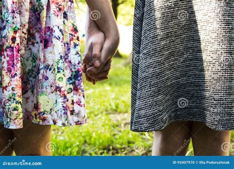 Sisters Holding Hands Outdoor Stock Photo Image Of Closeup Help