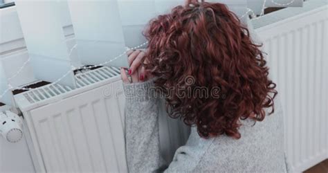 The Frozen Girl Hugs The Hot Radiator Hanging Under The Window Stock Footage Video Of Home
