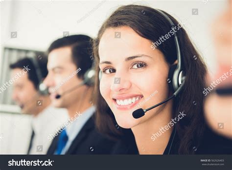 Beautiful Smiling Woman Working In Call Center As An Operator Or