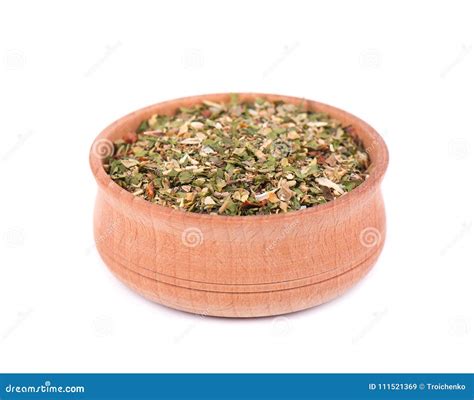 Mixed Italian Herbs Seasoning In A Wooden Bowl Isolated On White