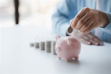 Person With Pile Of Coins And Piggy Bank Money Saving Concept For